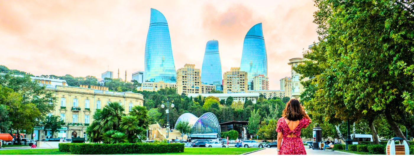 Baku Azerbaijan skyline featuring the Flame Towers, modern architecture and Caspian Sea waterfront.