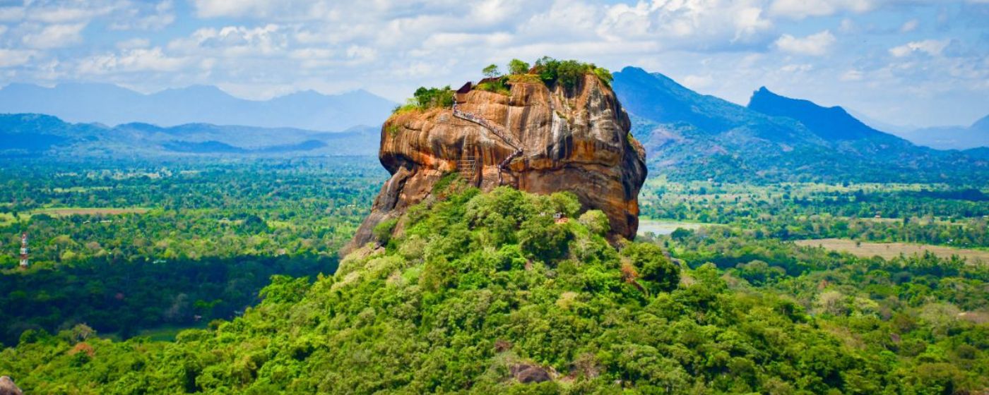 Sigiriya Rock Fortress and ancient cultural heritage surrounded by the lush landscape of Sri Lanka.